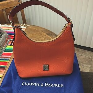 Like new Dooney and Bourke coral purse